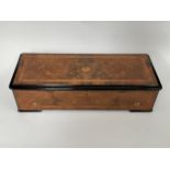 A late 19th Century Bremond cylinder music box playing 8 airs, with zither, flame walnut case and