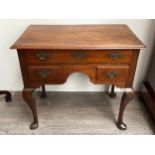 An 18th Century single drawer over two drawer lowboy on cabriole legs to pad feet, handle missing,