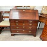 An 18th Century mahogany bureau with shaped pigeon hole and drawer interior, 101cm x 99cm x 55cm