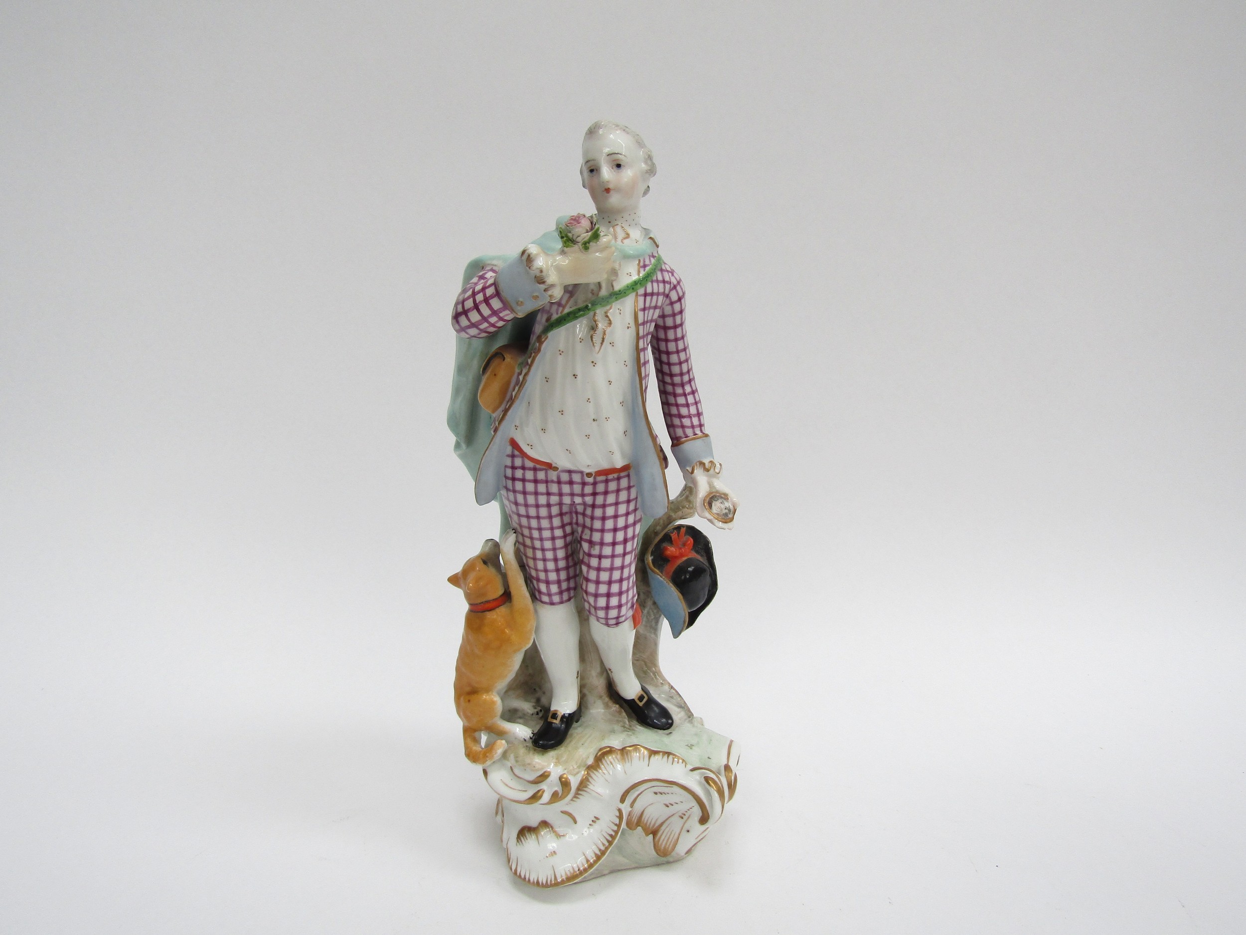 A late 18th/ early 19th Century porcelain figure of a gent carrying portrait miniature