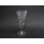 A late 19th Century conical ale glass with etched grape and vine detail, circular foot, 21cm tall