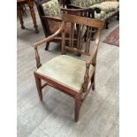 A George III carver chair with melon fluted detail to arm supports
