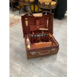 A 1908 crocodile skin gents travel case with grooming set contents, monogrammed M.S, with travel