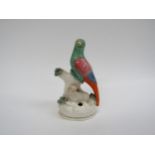 A 19th Century Staffordshire quill holder, exotic bird on branch with sheep