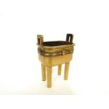 A Chinese gilt bronze incense burner raised on four legs, character marks to base, age undetermined,