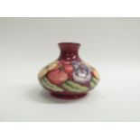 A Moorcroft Pansy pattern vase of squat form, 11cm tall