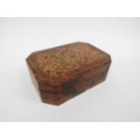 A walnut octagonal box with blind fret pattern to top