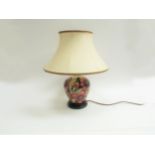 A Moorcroft Pheasant's Eye pattern table lamp by Shirley Hayes, silk shade with pink and green