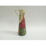 A Moorcroft Foxglove pattern slender jug by Rachel Bishop No.420 (crazing to cream ground) 24.5cm