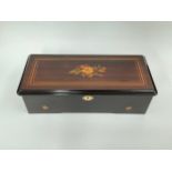 A 19th Century cylinder music box playing eight airs, rosewood and ebonised case with marquetry top,