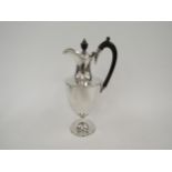 An Edwardian silver ewer, hardwood handle and knop, Sheffield 1909, 26cm tall, 447g