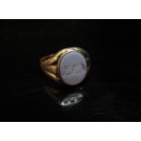A 15ct gold ring with oval agate intaglio monogrammed A.A.D. Size M/N, 3.9g