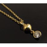 An 18ct gold chain, 48cm long, hung with a diamond and heart drop, 0.25ct approx, 3.6g
