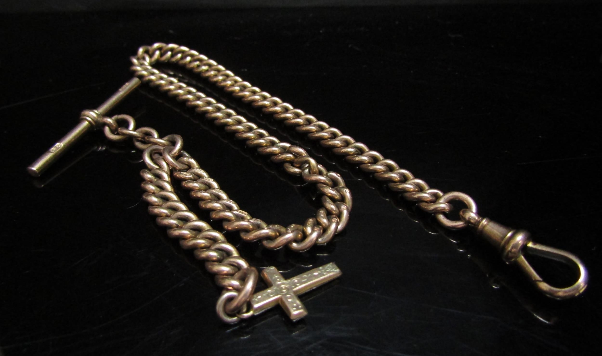 A 9ct gold watch chain hung with T-bar and cross charm, 33cm long, 43g