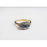A 9ct gold sapphire and diamond cluster ring. Size O, 2.4g