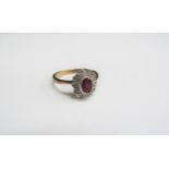 A 9ct gold amethyst and diamond cluster ring. Size Q, 2.8g