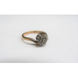 A 9ct gold diamond cluster ring. Size Q, 2.6g