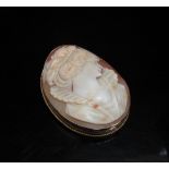 An oval carved shell cameo brooch in 9ct gold frame