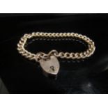 A 9ct gold bracelet with padlock clasp, 10.9g