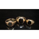 Three 9ct gold signet rings including bloodstone and onyx examples, sizes R, S and J, 8.9g