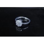 An 18ct white gold diamond cluster ring. Size Q, 4.1g