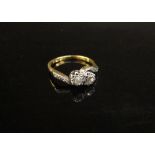 A diamond crossover ring with diamond set shoulders stamped 18ct/plat. Size K/L, 2.6g