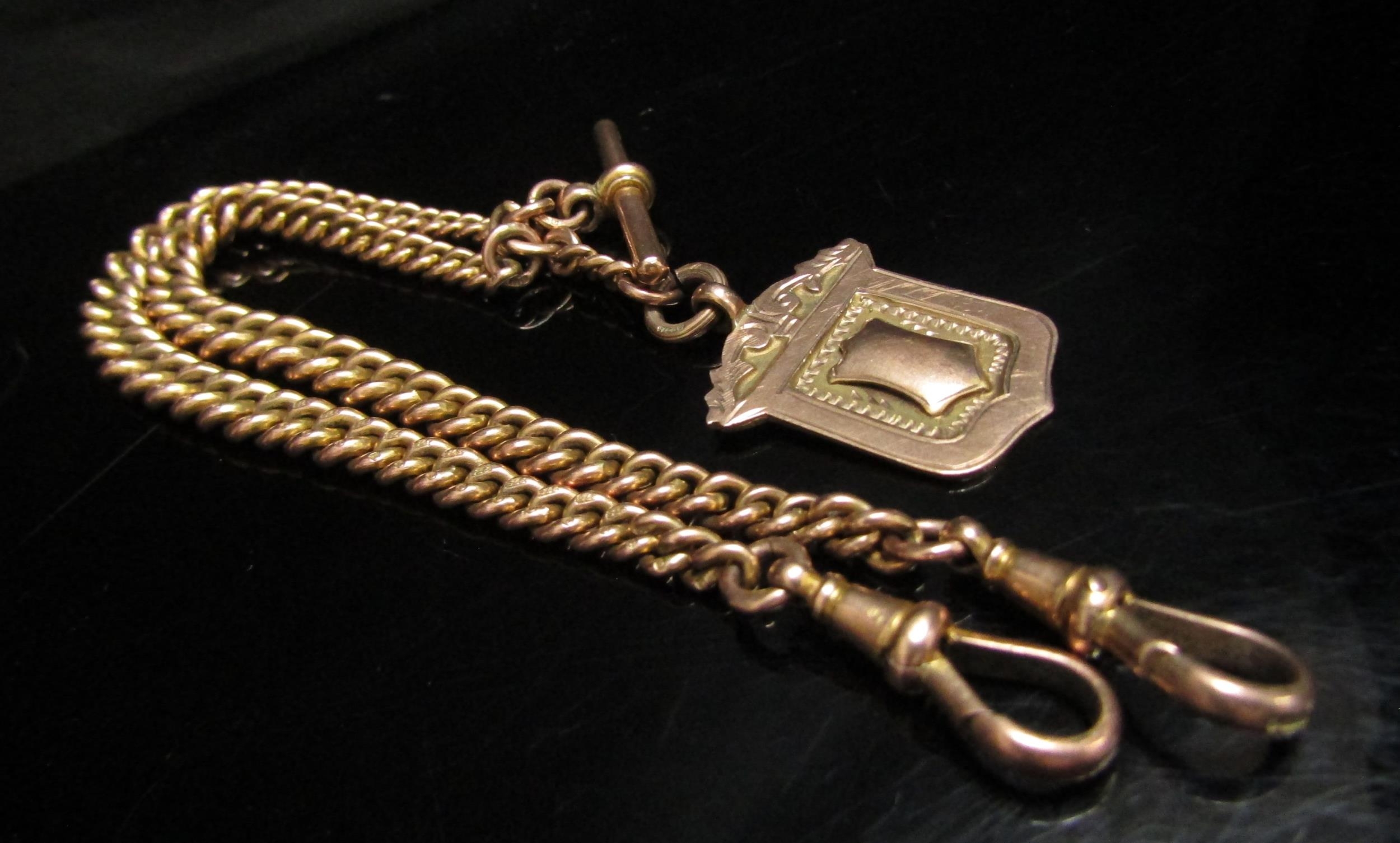 A 9ct gold watch chain, 36cm long hung with a 9ct gold Albert, 47.9g