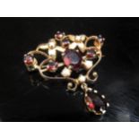 A 9ct gold garnet and seed pearl drop brooch, 6.5g