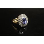 A tanzanite and diamond cluster ring, 16mm x 13mm total. Size /L, 5.7g
