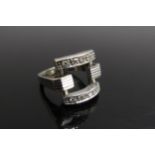 A white gold stylised ring with two rows of diamonds, stamped 750. Size H, 6.6g