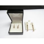 Four pairs of 9ct gold earrings including three tone heart drops, twisted barrel etc, 3g