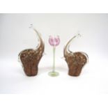 Two Murano style glass elephants, each with gold foil inclusions, tallest 24.5cm. Together with a