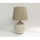 A Bitossi lamp base in white with impressed motifs (possibly made for Pier UK) with shade. Base 30cm