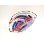 A Studio glass sculptural bowl by Jane Charles, clear glass with red and blue swirl line detail,