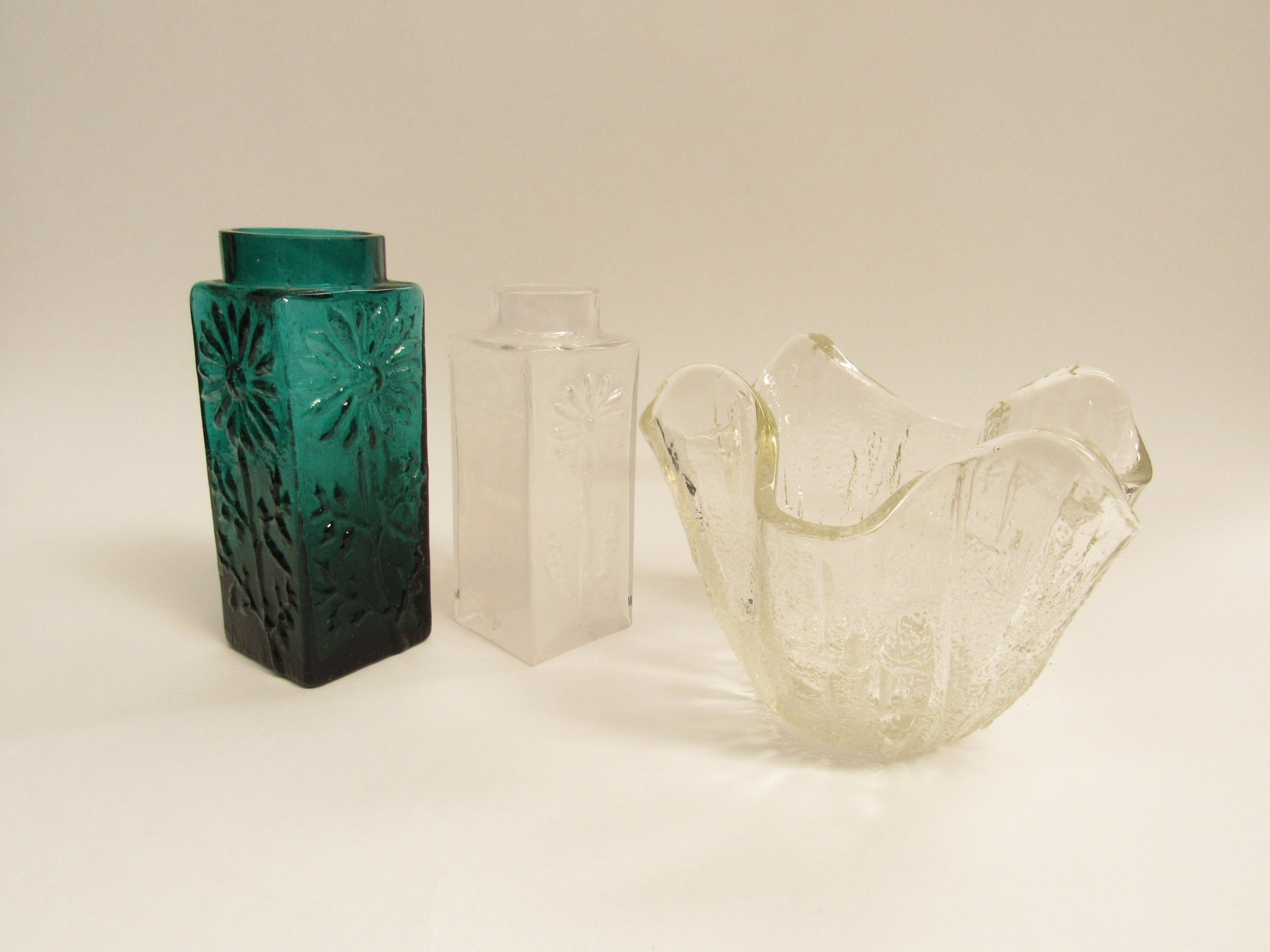 Two Dartington Glass flower vases by Frank Thrower and a clear glass handkerchief vase with