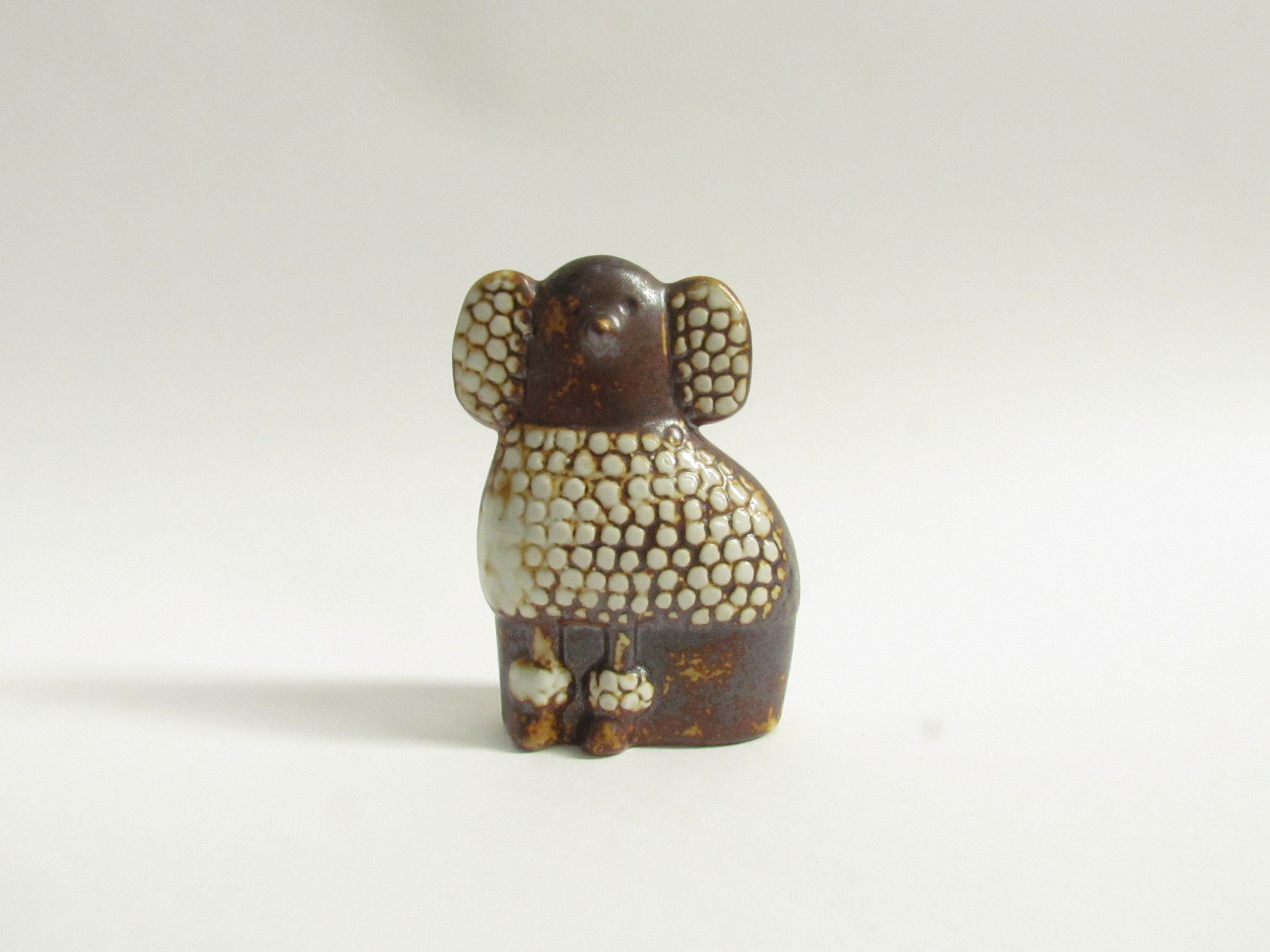 Lisa Larson for Gustavsberg - A ceramic figure of a Poodle. Impressed marks to base. 9cm high