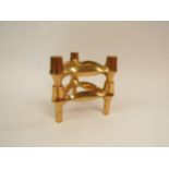 A pair of Nagel gold tone interlocking candle holders. 11cm high overall