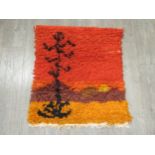 A Rya rug wall hanging with sunset design. 85cm x 75cm