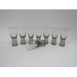 A set of eight Holmegaard "Canada" grey range shot glasses, 8cm tall