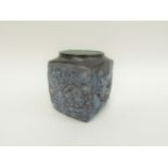 A Troika 'Marmalade' jar, rough textured with incised decoration and blue glaze. Painted marks to