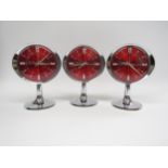 Three Westclox 'Big Ben' alarm clocks, each with red faces and chrome finish on tulip bases. 18.