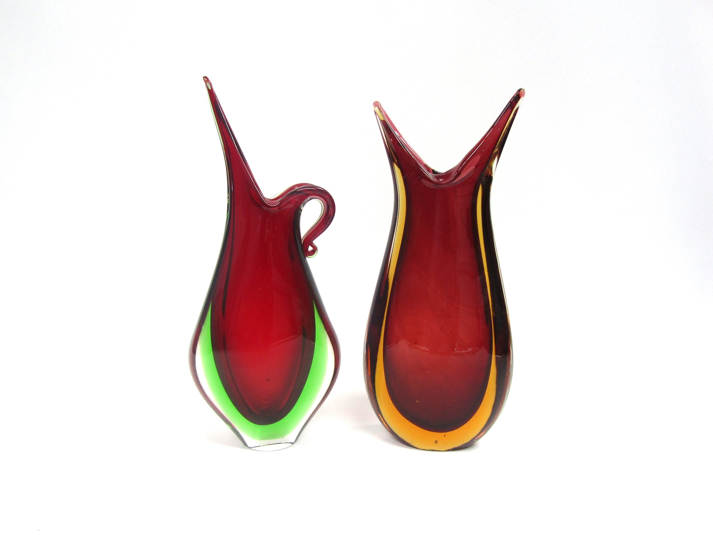 Two Murano Sommerso glass 'beak' vases in red and green and red and amber, encased in clear. Tallest