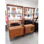 A pair of mid 20th Century Continental teak room dividing cabinets with open shelves above. Each