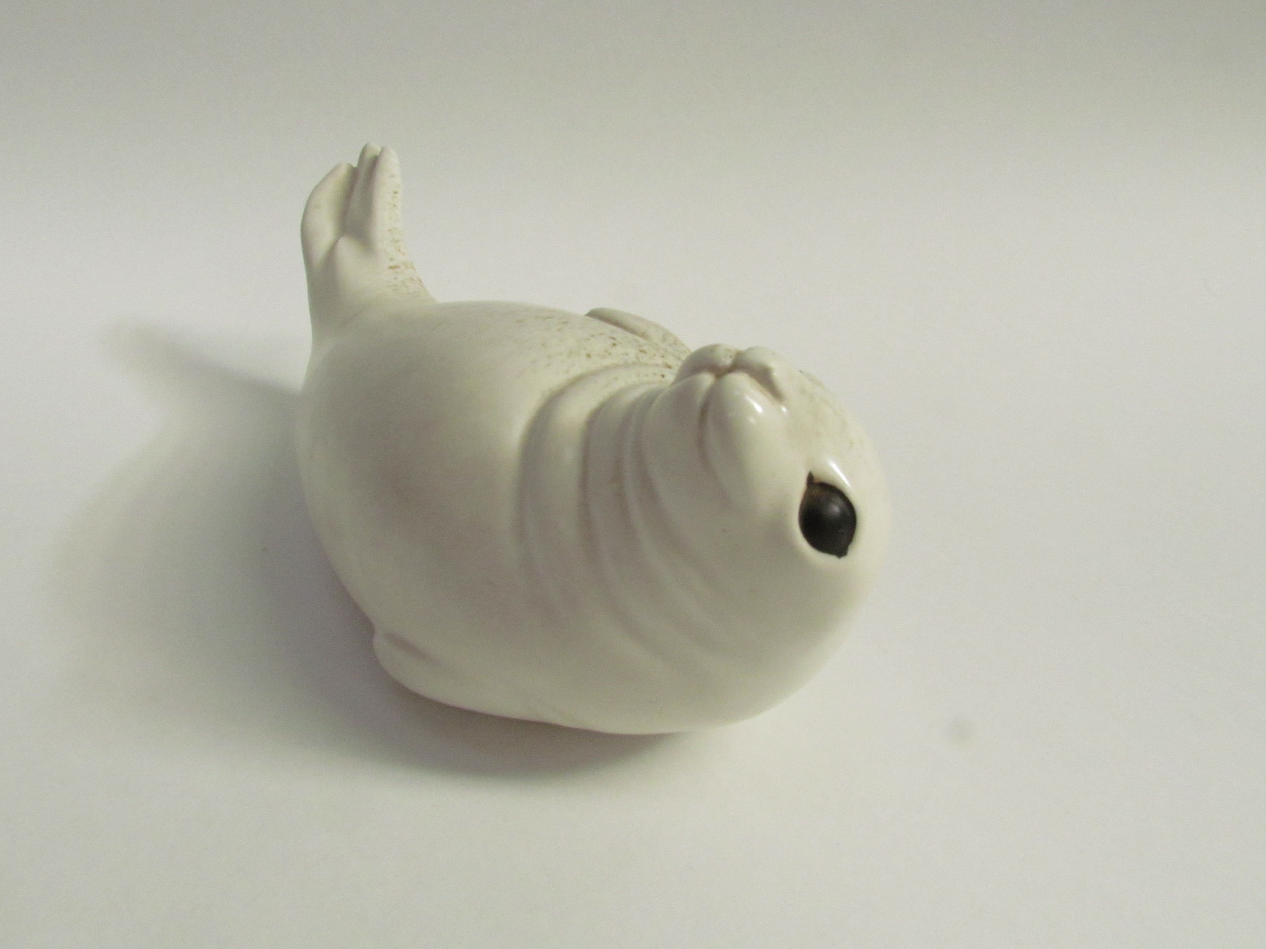 Paul Hoff for Gustavsberg - A ceramic figure of a Seal. Impressed marks to base. 9cm high x 24cm - Image 2 of 3