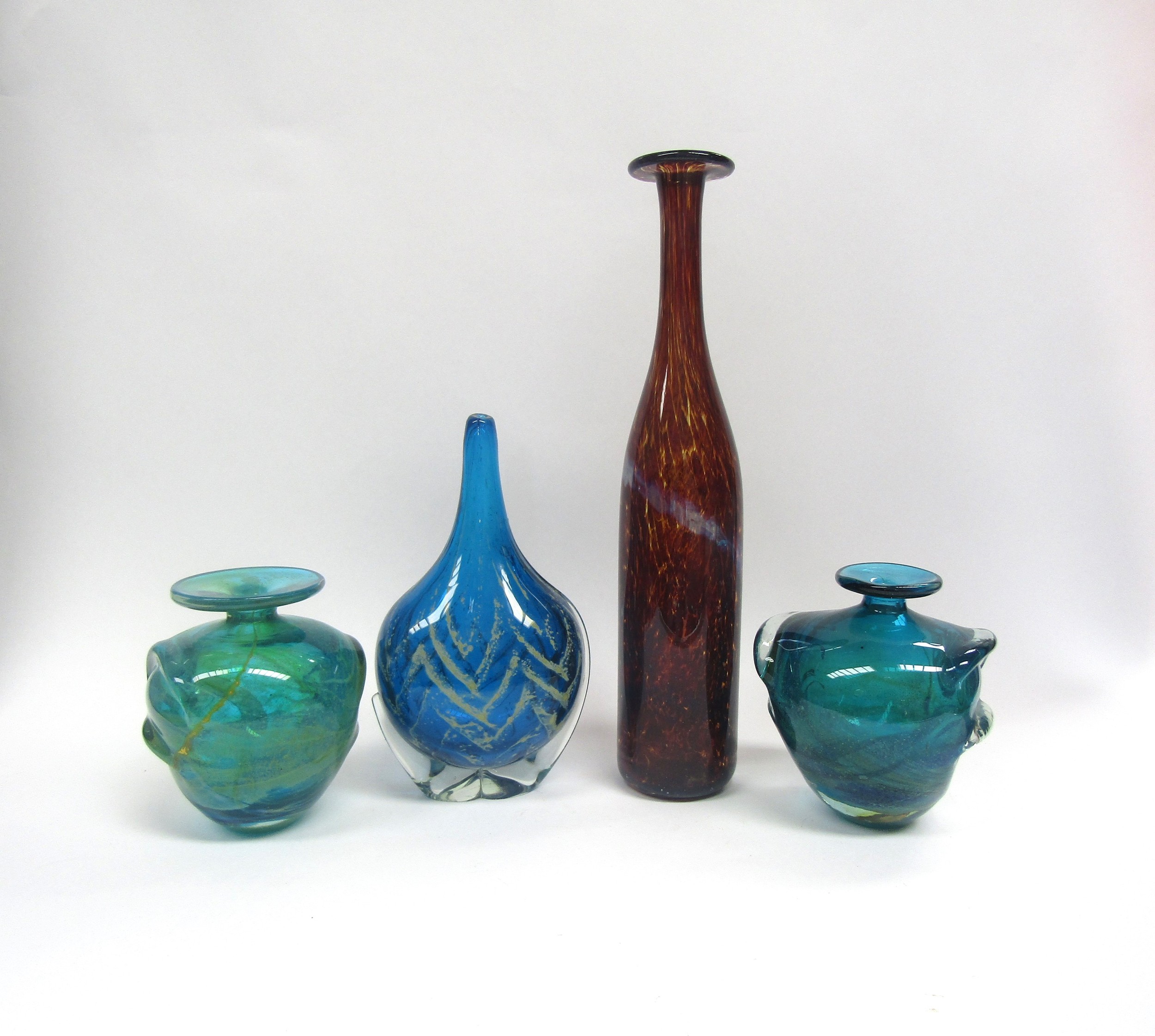 Four various Mdina Glass vases in Tortoiseshell and blue colourways. Tallest 38cm