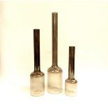 A set of three tall soda glass vases in grey and clear glass, tallest 50cm high