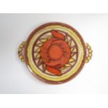 A Dumler & Breiden ceramic cake platter in orange glazes. 30.5cm diameter, 36cm with handles