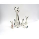 A collection of five Italian pottery figures of cats, variously decorated. Tallest 30cm