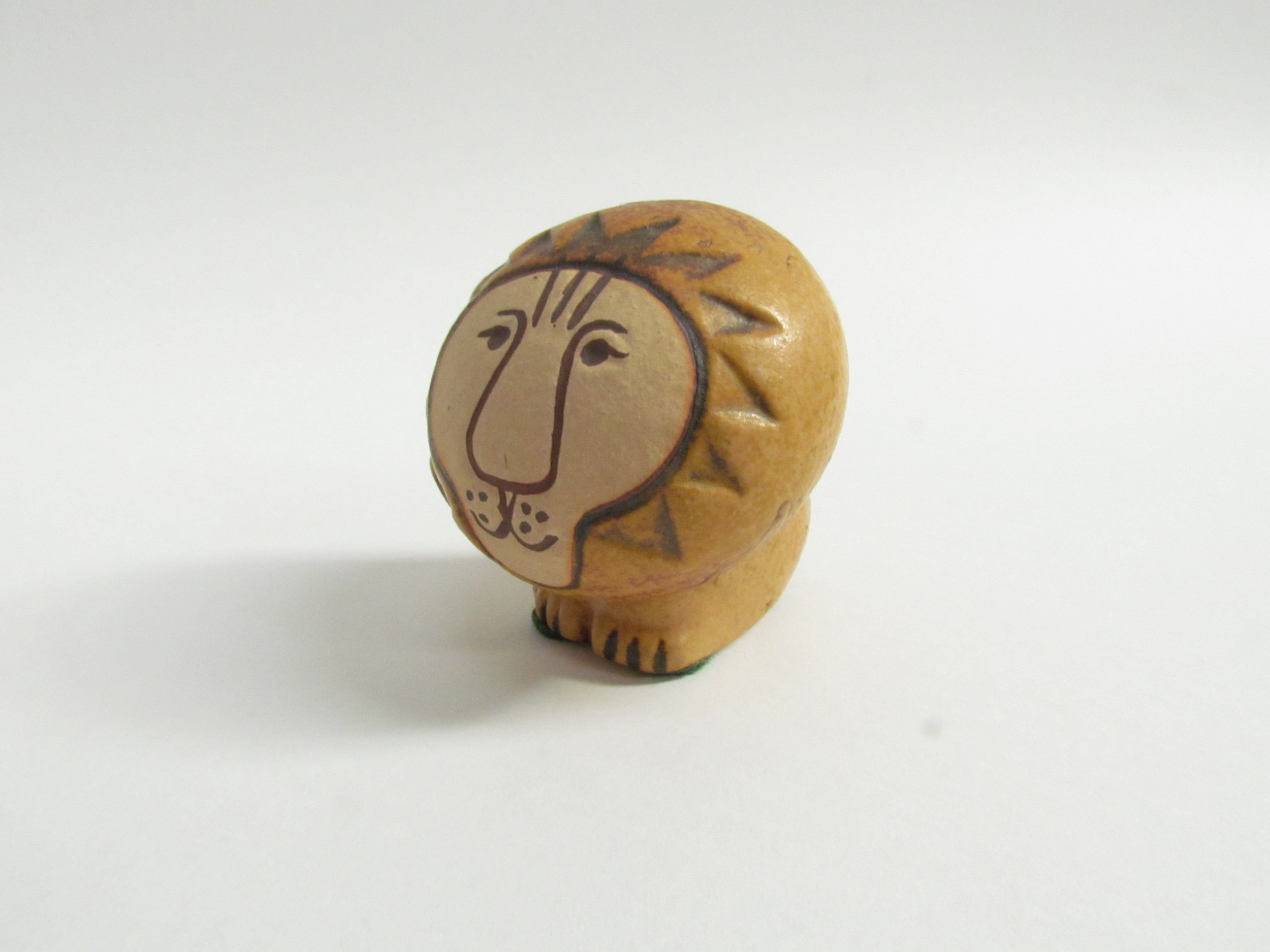 Lisa Larson for Gustavsberg - A small ceramic figure of a Lion, painted marks to base. 5.5cm high