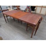 A Danish 'Bramin' teak extending dinning table on tapering legs together with a set of seagrass